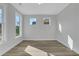 Bright living room featuring hardwood floors, recessed lights and large windows at 6640 Benchwood Path, Cumming, GA 30028