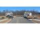 New construction homes are visible down a neighborhood street at 6060 Spring Way, Stonecrest, GA 30038