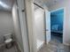 Well-lit bathroom featuring a walk-in shower with curtain and modern fixtures at 3290 Forest Green Dr, Douglasville, GA 30135