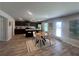 Bright kitchen and dining area with stainless steel appliances, breakfast bar, and a cozy dining table at 3290 Forest Green Dr, Douglasville, GA 30135
