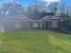 Brick house with a gray roof, and a neatly landscaped lawn at 5321 Tuscany Dr, Douglasville, GA 30135