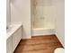Bright bathroom with a shower over tub and a single sink vanity at 320 Rebecca Lake Way, Fairburn, GA 30213