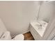 Cozy bathroom with a toilet, vanity, and a large mirror at 320 Rebecca Lake Way, Fairburn, GA 30213