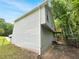 Charming two-story home with vinyl siding and small wooden deck in a wooded area at 320 Rebecca Lake Way, Fairburn, GA 30213