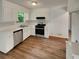 Bright kitchen with modern appliances, stainless steel oven, and wooden floors at 320 Rebecca Lake Way, Fairburn, GA 30213