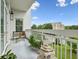 Relaxing condo balcony features outdoor seating, decor, a pristine white railing, and a beautiful view at 2500 Peachtree Nw Rd # 405S, Atlanta, GA 30305