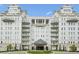 Facade of elegant condo building featuring balconies and manicured greenery at 2500 Peachtree Nw Rd # 405S, Atlanta, GA 30305