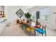 Elegant dining room showcases a grand table, stylish chairs, art, and natural light from multiple windows at 2500 Peachtree Nw Rd # 405S, Atlanta, GA 30305