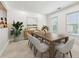 Spacious dining room with modern table, chairs, stylish décor, and natural light at 2500 Peachtree Nw Rd # 405S, Atlanta, GA 30305