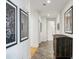 Hallway featuring tiled flooring, modern art and a distressed wood accent piece at 2500 Peachtree Nw Rd # 405S, Atlanta, GA 30305