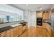 Modern kitchen with granite countertops, wooden cabinetry, stainless steel appliances, and hardwood flooring at 2500 Peachtree Nw Rd # 405S, Atlanta, GA 30305