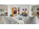 Spacious open-concept living area featuring plush sofas, sleek decor, and abundant natural light throughout at 2500 Peachtree Nw Rd # 405S, Atlanta, GA 30305