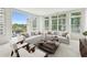 Bright living room with large windows, hardwood floors, and comfortable seating area at 2500 Peachtree Nw Rd # 405S, Atlanta, GA 30305