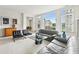 Bright and airy living room with modern furnishings and large windows, leading to dining at 2500 Peachtree Nw Rd # 405S, Atlanta, GA 30305