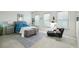 Bright bedroom featuring three windows, a sitting area, and generous natural light at 2500 Peachtree Nw Rd # 405S, Atlanta, GA 30305