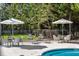 Outdoor pool area with comfortable seating and shade umbrellas for leisurely days at 2500 Peachtree Nw Rd # 405S, Atlanta, GA 30305