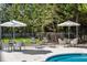 Comfortable poolside lounge area with tables, chairs, and umbrellas at 2500 Peachtree Nw Rd # 405S, Atlanta, GA 30305