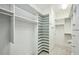 Walk-in closet featuring custom shelving and ample space at 2500 Peachtree Nw Rd # 405S, Atlanta, GA 30305