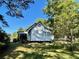 A white home is viewed in the beautiful backyard setting at 3970 Norman Rd, Stone Mountain, GA 30083