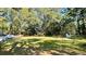Large, grassy backyard, ideal for recreation and outdoor activities, features a small storage shed at 3970 Norman Rd, Stone Mountain, GA 30083