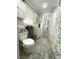 Clean bathroom features a toilet, cabinet sink, storage, and shower/bath at 3970 Norman Rd, Stone Mountain, GA 30083