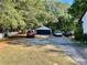 Large driveway offers ample parking space in front of a two-car garage at 3970 Norman Rd, Stone Mountain, GA 30083
