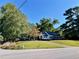 Picturesque home with black shutters and a screened porch set on a verdant lawn, blending charm and tranquility at 3970 Norman Rd, Stone Mountain, GA 30083