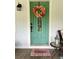 Charming front door adorned with a festive fall wreath, creating a welcoming entrance at 3970 Norman Rd, Stone Mountain, GA 30083