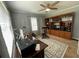 Functional home office featuring built-in shelving, a ceiling fan, and a dedicated workspace at 3970 Norman Rd, Stone Mountain, GA 30083