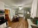 Eat-in kitchen featuring modern stainless steel appliances, wood floors, and granite countertops at 3970 Norman Rd, Stone Mountain, GA 30083