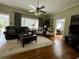 Bright and airy living room with hardwood floors, comfortable seating, and an open layout at 3970 Norman Rd, Stone Mountain, GA 30083