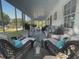Cozy screened porch with wicker seating, decorative pillows, and tranquil garden views at 3970 Norman Rd, Stone Mountain, GA 30083