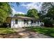 Beautiful one-story home with fresh landscaping, updated windows and a bright blue front door at 123 Arnold Pl, Jonesboro, GA 30236