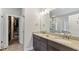 Elegant bathroom featuring double sinks, granite countertops, and a glass-enclosed shower at 1995 Woodmont Dr, Douglasville, GA 30135