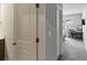Bedroom with plush carpet, a window view, and desk area located off of a hallway at 1995 Woodmont Dr, Douglasville, GA 30135