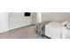 Bright bedroom features plush carpet and a tv, creating a comfortable and relaxing atmosphere at 1995 Woodmont Dr, Douglasville, GA 30135
