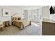 Bright bedroom featuring a bay window, accent pillows, and neutral decor at 1995 Woodmont Dr, Douglasville, GA 30135