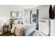 Inviting bedroom featuring a comfortable bed, dresser, and natural light from a window at 1995 Woodmont Dr, Douglasville, GA 30135