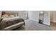 Inviting bedroom featuring a plush bed, a large window and a decorative full-length mirror at 1995 Woodmont Dr, Douglasville, GA 30135
