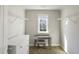 Bright closet features a desk with a window and shelving, perfect for organizing belongings at 1995 Woodmont Dr, Douglasville, GA 30135
