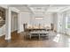 Bright dining room with a large table, coffered ceiling, and hardwood floors at 1995 Woodmont Dr, Douglasville, GA 30135