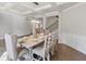 Elegant dining room with a farmhouse table and hardwood floors at 1995 Woodmont Dr, Douglasville, GA 30135