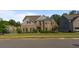 Brick two-story house with gray accents and a manicured lawn at 1995 Woodmont Dr, Douglasville, GA 30135