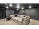 Finished basement home theater with sectional sofa and projector at 1995 Woodmont Dr, Douglasville, GA 30135