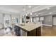 Island kitchen with granite countertops and stainless steel appliances at 1995 Woodmont Dr, Douglasville, GA 30135