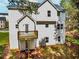 Back exterior view of home featuring white siding, a deck, and ample yard space at 6462 Beaver Creek Trl, Atlanta, GA 30349