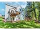 Exterior view of backyard and deck in home with well maintained lawn and surrounding landscape at 6462 Beaver Creek Trl, Atlanta, GA 30349