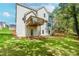 The backyard is a lush green space adjacent to the wooded area beyond the house at 6462 Beaver Creek Trl, Atlanta, GA 30349