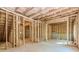 Unfinished basement with stud walls, plumbing, and electrical, offering a blank canvas for customization at 6462 Beaver Creek Trl, Atlanta, GA 30349