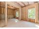 Unfinished basement area showcasing studded walls and windows for future living space and personalization at 6462 Beaver Creek Trl, Atlanta, GA 30349
